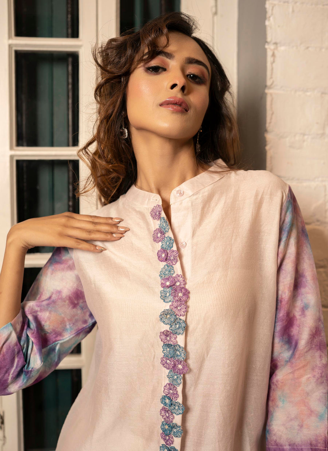 Close up of Purple Bomb Dye Shirt With 3D Applique Flowers